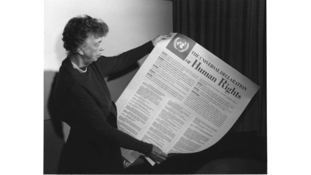 Former U.S. First Lady Eleanor Roosevelt (1884–1962) holding the official English-language copy of the Universal Declaration of Human Rights, adopted in 1948. 